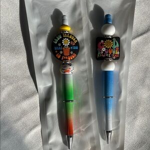 Set of Whimsical Flower Badge Retractable Pens - Green/Red & Blue